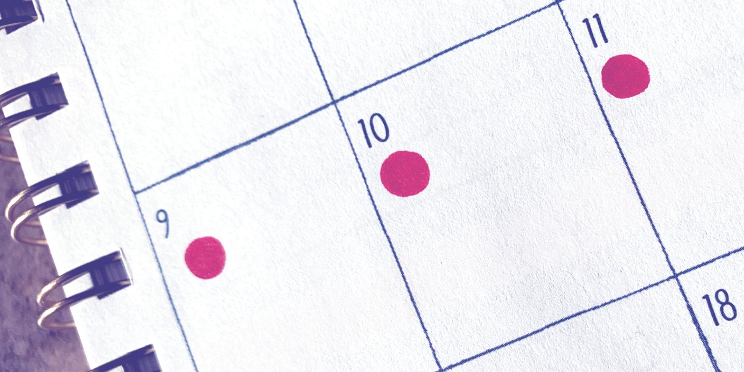 Red dots on a calendar signify when a person had their period.