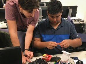 Data Science summer program student working with instructor