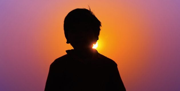 Child in front of sun