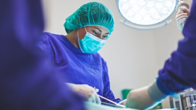 Surgeon operating in an OR