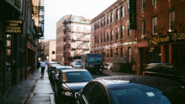 A long row of cars parked in Boston