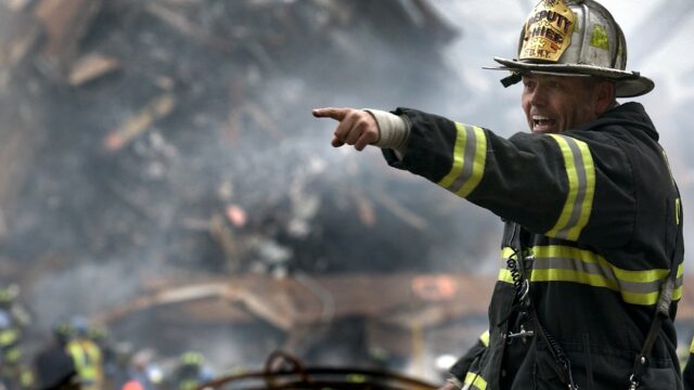 Firefighter in front of wreckage