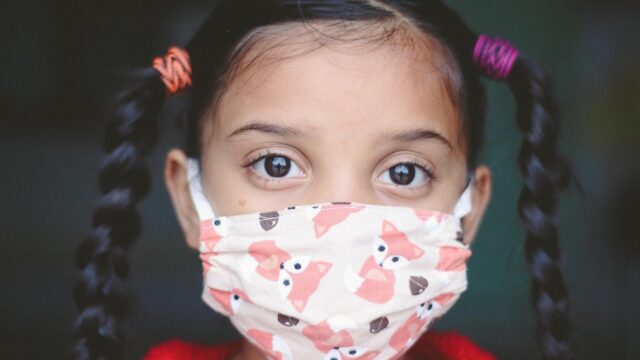 Little girl wearing a face mask