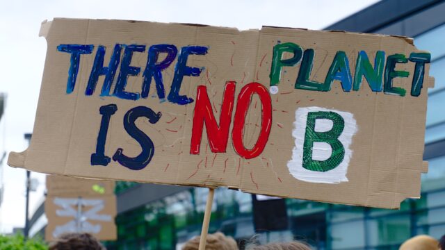 Cardboard sign with the words "There is no planet B."