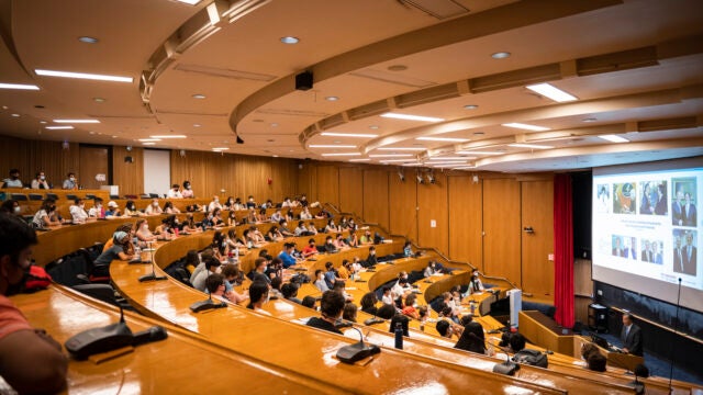 Students watch a presentation at Harvard