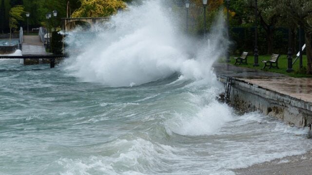 Hurricane waves breaking on a city park