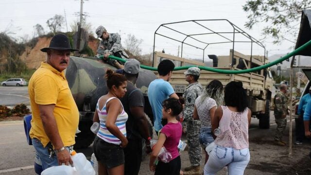 Puerto Rico National Guard distributes water to families after Hurricane Maria