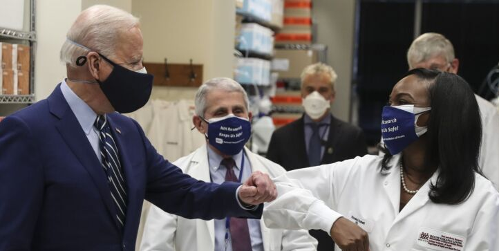 President Joe Biden wears a protective mask while greeting Kizzmekia Corbett during a tour of NIH's campus in Bethesda, Maryland, Feb. 11, 2021. Photographer: Oliver Contreras/Sipa/Bloomberg