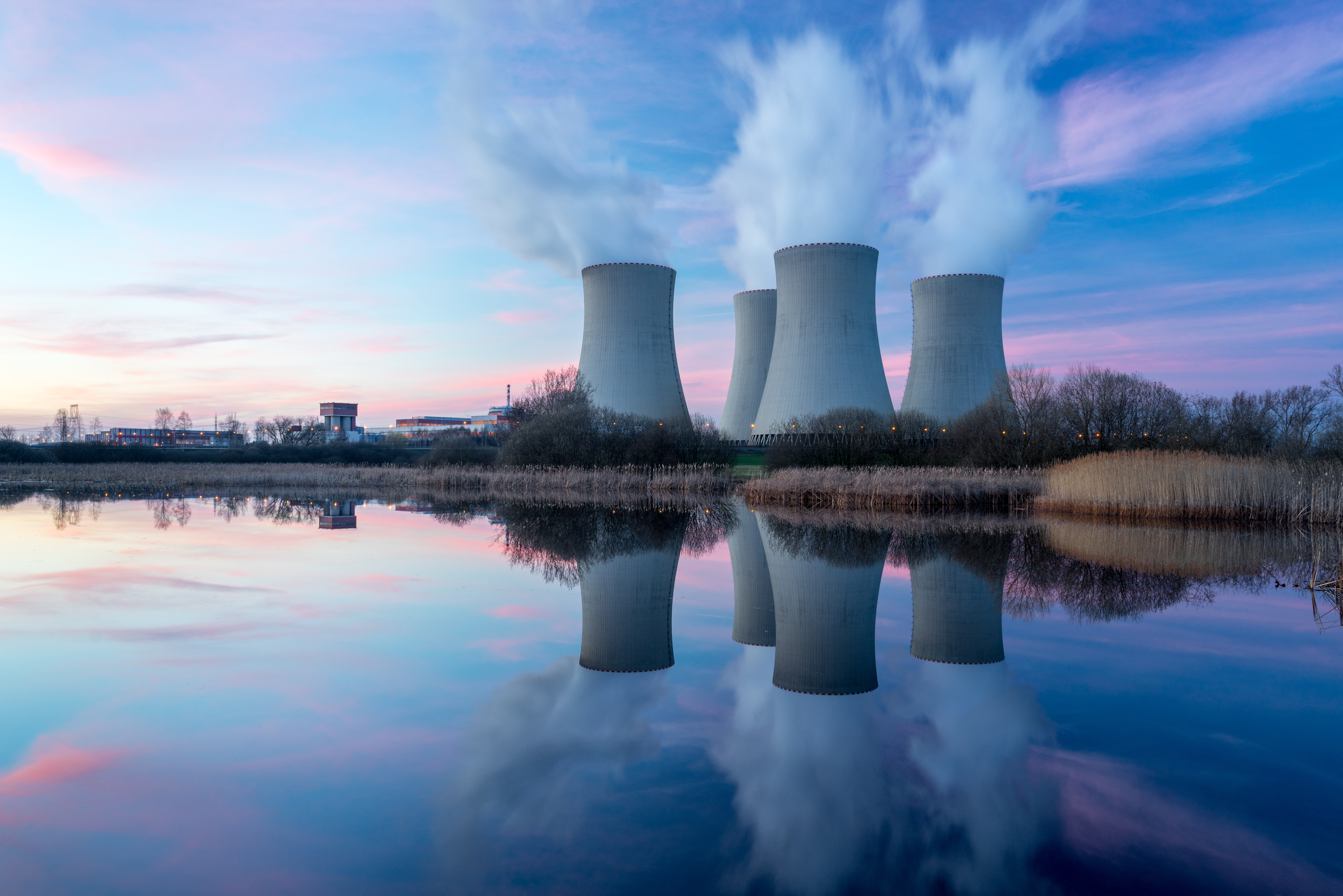 Photo of an active nuclear power plant taken during a sunset