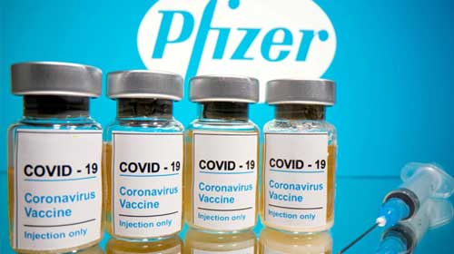 A row of COVID-19 vaccine bottles