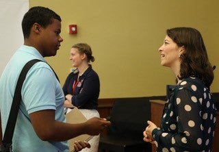 Dr. Claudia Trudel-Fitzgerald and student having a conversation