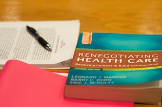 miscellaneous papers and a textbook on renegotiating health care