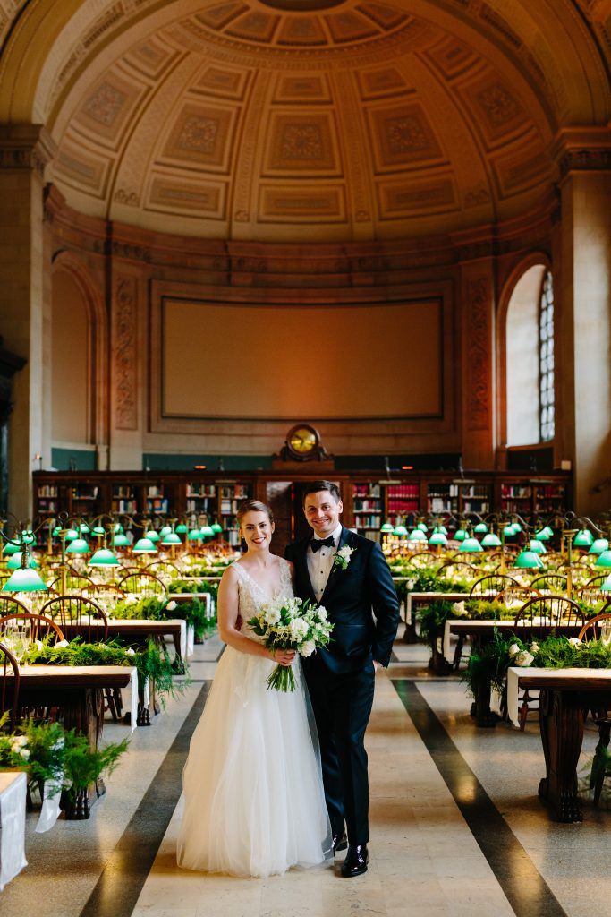 bride and groom posing at boston public library
