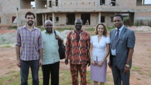 Christian Happi (center) and Pardis Sabeti (second from right) with colleagues on the campus of Irrua Specialist Teaching Hospital in rural Nigeria in 2013. Courtesy Pardis Sabeti