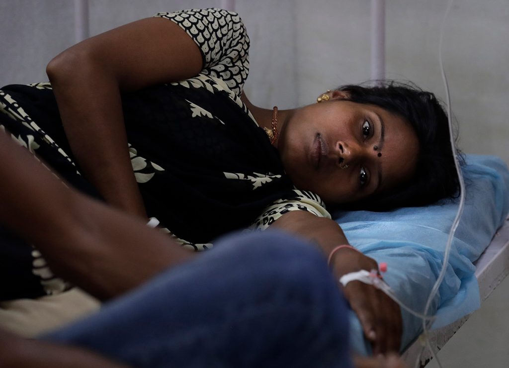 woman receives treatment at a clinic in New Delhi, India