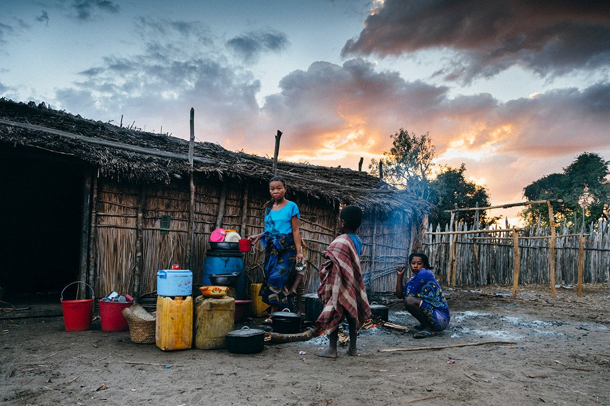 In the arid ecosystem of the Morombe region, southwestern Madagascar, villagers store water from a distant lake and underground source in jugs and use it for outdoor cooking.