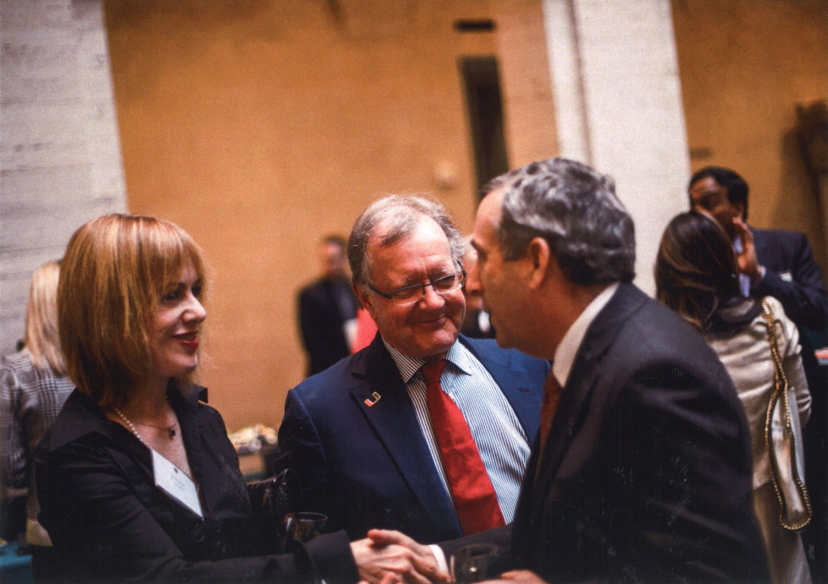 Joyce Huntley Quelch and John Quelch with Harvard President Larry Bacow