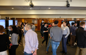 Students from labs throughout the department of Molecular Metabolism discuss their work at the poster session held by the department on May 3rd