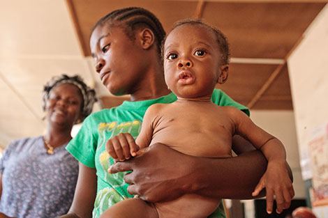 Leona Hunter, 18, holds her son Cephas Hunter, 10 months old, who suffers from severe malnutrition