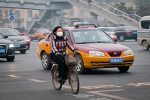 woman biking in Beijing