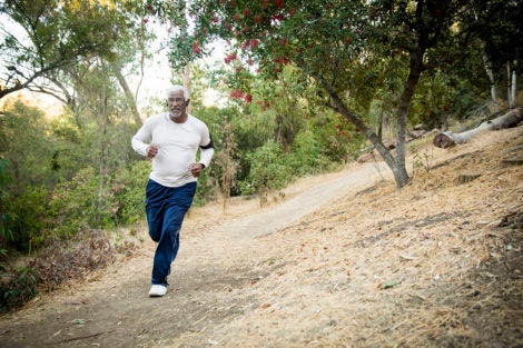 Photo of man jogging in woods