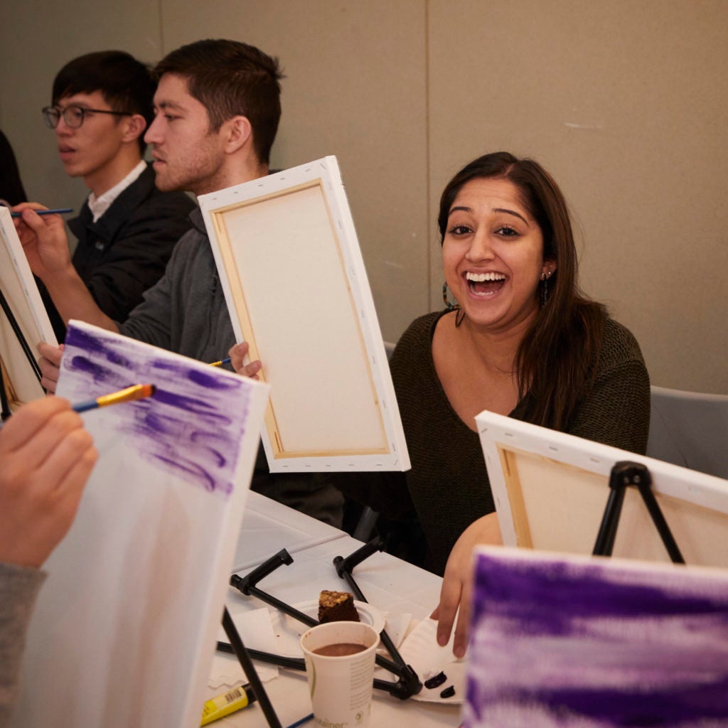 Student laughing at paint night