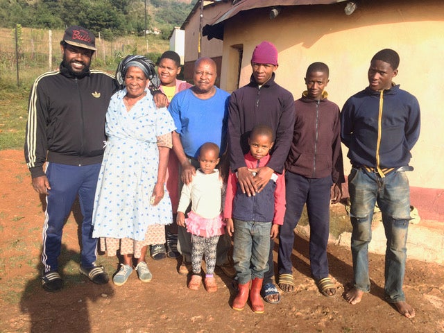 Joel Burt-Miller with his host family in Sandanezwe, a rural community outside of Durban, South Africa, 2015
