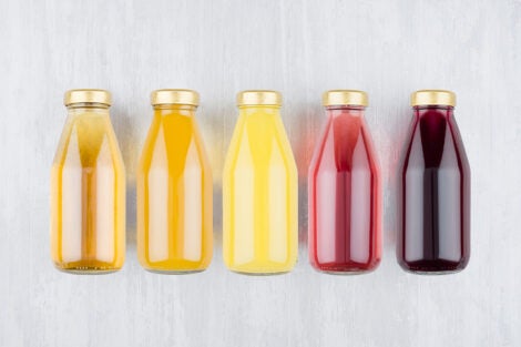 Five bottles of various kinds of fruit juice