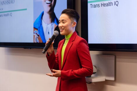 Hsiao speaking while standing at the front of the room