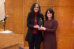 Marcia Castro and Jessica Cohen pose with the Alice Hamilton award