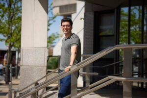 Jeremy Cygler standing on steps of Harvard Chan School building
