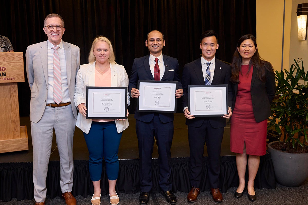 Kasey Pomeroy, Faisal Reza, and Patrick Chen with Andrea Baccarelli, dean of the faculty (left), and Jane Kim, dean for academic affairs (right)