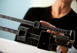 Measuring someone's weight on a scale