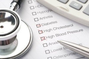 Medical conditions diabetes and cholesterol checked on a medical test result form