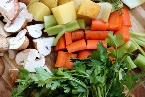 Variety of vegetables including parsley mushroom potatoes carrots leeks
