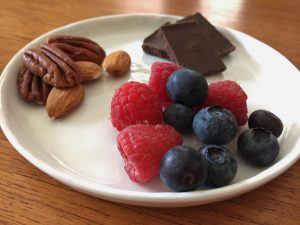 Raspberries, blueberries, dark chocolate, pecans, and almonds