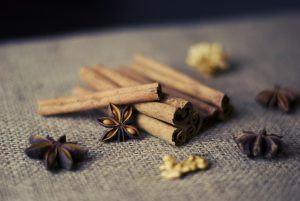 cinnamon sticks, nuts, and star anise