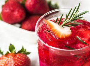 Glass of fruit cooler with strawberries
