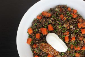 French style lentils cooked with carrots, shallots, olive oil, and topped with whole grain mustard, chives, and some creme fraiche.
