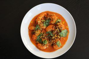 Shrimp with red curry and crispy sprouted lentils