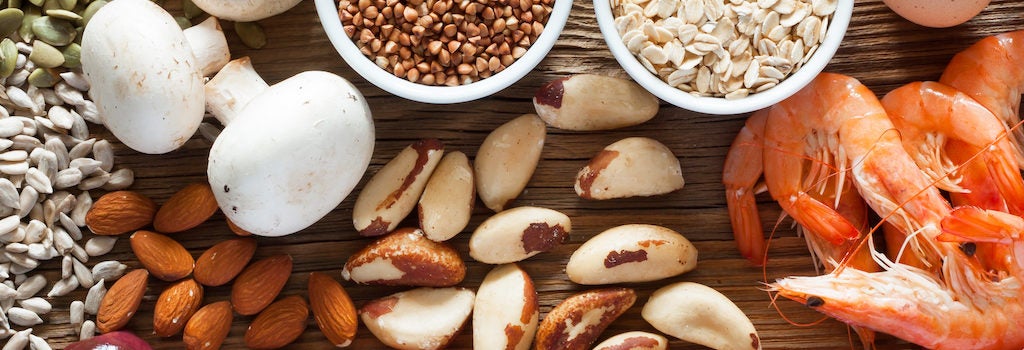 Foods containing the trace mineral selenium, including brazil nuts, almonds, mushrooms, oats, eggs, pumpkin seeds, flaxseeds, fish, chicken, liver, and meat