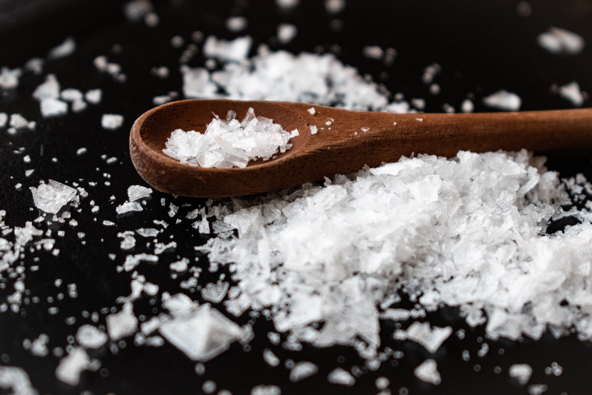 a spoon with salt, or sodium chloride
