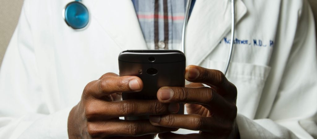 Doctor holding phone