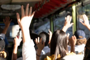 Students raising hands.