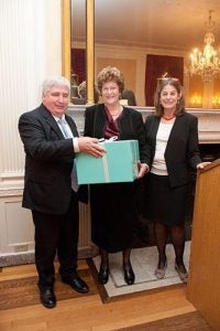 David Canning and Lisa Berkman present Mary Paci with a Tiffany gift