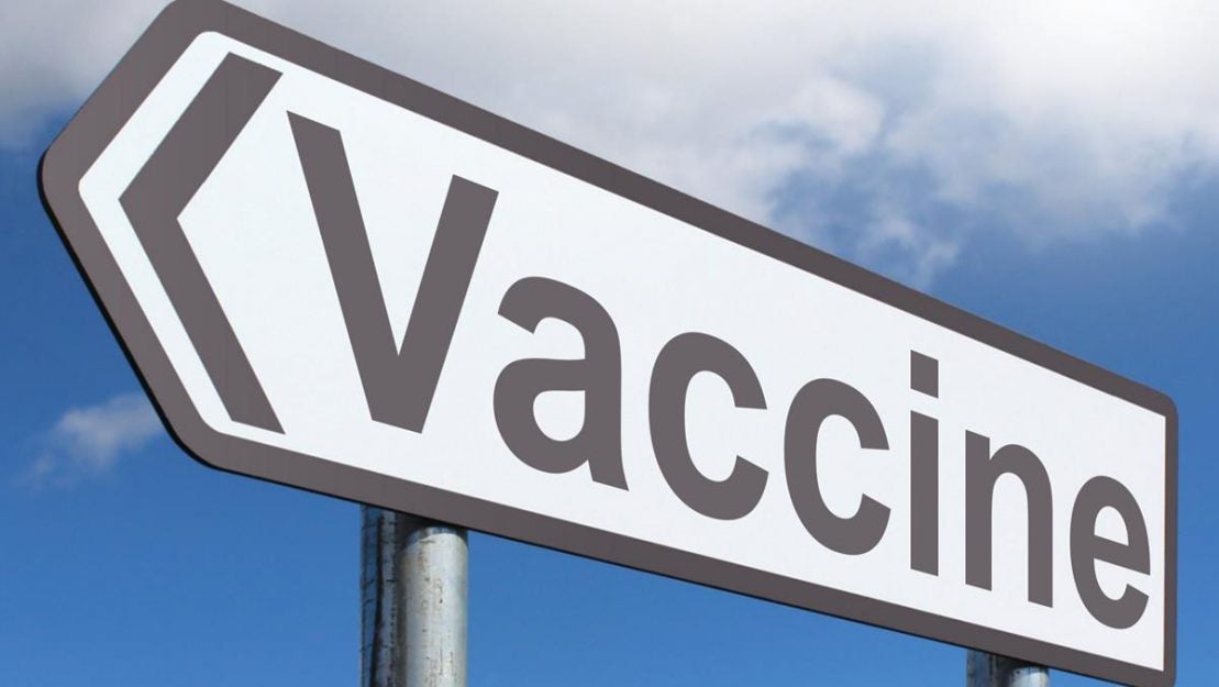 Sign with vaccine pointing in a direction courtesy of unsplash.com