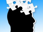 Illustration of profile of a person's head with puzzle pieces