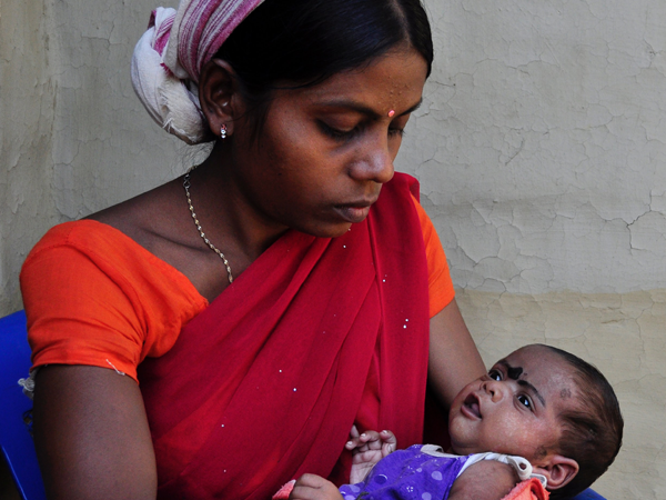 Indian mother holding baby