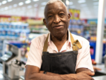 Older man of color working in a grocery store