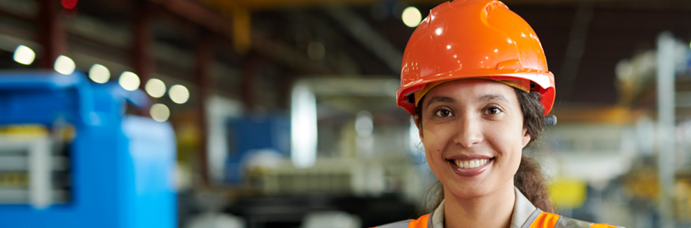 Work and Well-Being Initiative homepage image_woman in orange hard hat